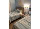 Cozy bedroom featuring two beds with coastal-themed bedding, lamps, and complementing decor at 2701 S. Ocean B S Ocean Blvd. # 508, North Myrtle Beach, SC 29582
