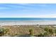 Beautiful ocean view with beach from condo building, with dune grasses and blue skies at 2701 S. Ocean B S Ocean Blvd. # 508, North Myrtle Beach, SC 29582