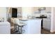 Modern kitchen island with granite countertop and seating for three at 3528 Bells Lake Circle # 3528, Longs, SC 29568