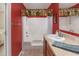 Clean bathroom with shower/tub combo and wood vanity at 3790 Woodridge Circle, Little River, SC 29566