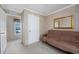 Bedroom with a futon and a large window at 3790 Woodridge Circle, Little River, SC 29566