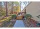 Steps lead up to a spacious wooden deck, perfect for outdoor relaxation at 3790 Woodridge Circle, Little River, SC 29566