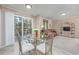 Dining area with glass table and chairs, overlooking backyard at 3790 Woodridge Circle, Little River, SC 29566