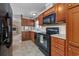 Modern kitchen with ample cabinetry and a large refrigerator at 3790 Woodridge Circle, Little River, SC 29566