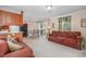 Open living space with a comfortable couch and access to the kitchen at 3790 Woodridge Circle, Little River, SC 29566
