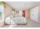 Spacious bedroom with a queen-size bed and access to the bathroom at 3790 Woodridge Circle, Little River, SC 29566