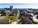 An aerial view captures a charming coastal community with various houses near a serene ocean at 403 20Th Ave. N, North Myrtle Beach, SC 29582