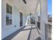 Relaxing balcony overlooking neighborhood, featuring light blue siding and ceiling fan at 434 Stanley Dr., Murrells Inlet, SC 29576