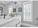 Double vanity bathroom with white cabinets and a bright, airy feel at 434 Stanley Dr., Murrells Inlet, SC 29576