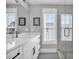 Bathroom with white cabinets, quartz countertop, and a glass shower at 434 Stanley Dr., Murrells Inlet, SC 29576