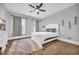 Bright bedroom with white bed frame, gray walls, and hardwood floors at 434 Stanley Dr., Murrells Inlet, SC 29576