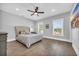 Main bedroom with plush upholstered bed and large windows at 434 Stanley Dr., Murrells Inlet, SC 29576