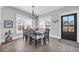 Dining room with a farmhouse table, six chairs, and a chandelier at 434 Stanley Dr., Murrells Inlet, SC 29576