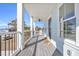 Front porch with gray floor, black railing, ceiling fan, and welcoming mat at 434 Stanley Dr., Murrells Inlet, SC 29576