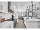 Bright kitchen featuring white cabinets, a large island, and stainless steel appliances at 434 Stanley Dr., Murrells Inlet, SC 29576