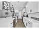Modern kitchen with white cabinets, quartz countertops, and stainless steel appliances at 434 Stanley Dr., Murrells Inlet, SC 29576