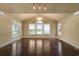 Bright living room with dark wood floors, plenty of natural light and textured wall paper at 4440 Lady Banks Ln. # 10H, Murrells Inlet, SC 29576