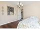 Bedroom with hardwood flooring, a ceiling fan, and neutral wall colors at 461 Spauldingwood Rd., Little River, SC 29566