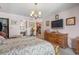 Bedroom features large dresser and access to an ensuite bathroom and kitchen at 461 Spauldingwood Rd., Little River, SC 29566