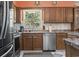 Well-equipped kitchen with stainless steel appliances and wooden cabinetry at 461 Spauldingwood Rd., Little River, SC 29566