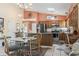 Bright eat-in kitchen featuring wooden cabinets, stainless steel appliances, and a large island at 461 Spauldingwood Rd., Little River, SC 29566