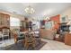 Spacious living room featuring hardwood floors, tile flooring, comfortable seating, and natural light at 461 Spauldingwood Rd., Little River, SC 29566