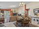 An open-concept living room features a fireplace, tile flooring, and comfortable seating for entertaining at 461 Spauldingwood Rd., Little River, SC 29566