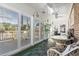 Bright sun room with tile floors and multiple windows to the deck at 461 Spauldingwood Rd., Little River, SC 29566
