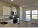 This kitchen boasts stainless steel appliances, granite countertops, and bright lighting at 4745 Huckleberry Ln., Conway, SC 29526