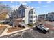 Three-story townhome with gray siding, multiple balconies, and ample parking at 4999 Highway 17 Business # 108 D, Murrells Inlet, SC 29576