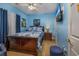 Blue bedroom with a double bed and TV at 5090 Windsor Green Way # 104, Myrtle Beach, SC 29579