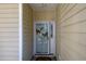 Condo entrance with glass door and butterfly decor at 5090 Windsor Green Way # 104, Myrtle Beach, SC 29579