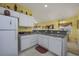 Kitchen with white cabinets and granite countertops at 5090 Windsor Green Way # 104, Myrtle Beach, SC 29579