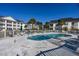 Community pool with lounge chairs and umbrellas at 5090 Windsor Green Way # 104, Myrtle Beach, SC 29579