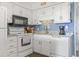 Clean and bright kitchen with white cabinets at 5601 North Ocean Blvd. # B-312, Myrtle Beach, SC 29577