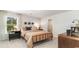 Cozy bedroom featuring a black iron bed frame, decorative lighting, and neutral tones at 593 Haven View Way, Murrells Inlet, SC 29576