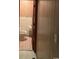 Bathroom adjacent to paneled hallway at 5944 Rose Hill Rd., Georgetown, SC 29440