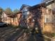 Rustic brick home featuring a covered porch and mature trees in a country setting at 5944 Rose Hill Rd., Georgetown, SC 29440