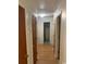Hallway with wood look floor leading to bathroom at 5944 Rose Hill Rd., Georgetown, SC 29440