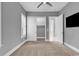 Bright bedroom with a ceiling fan, gray walls, carpet and a large closet at 5960 Bolsena Place, Myrtle Beach, SC 29577