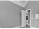 Light and airy bedroom with vaulted ceiling, modern chandelier and an entry door to the hallway at 5960 Bolsena Place, Myrtle Beach, SC 29577