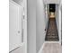 Hallway with staircase that leads up to the theatre room at 5960 Bolsena Place, Myrtle Beach, SC 29577