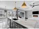 Spacious kitchen with a marble island, modern faucet, stainless steel appliances and views to the living room at 5960 Bolsena Place, Myrtle Beach, SC 29577