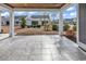 Relax on the covered patio with large tile flooring and beautiful views of the surrounding landscaping at 5960 Bolsena Place, Myrtle Beach, SC 29577