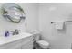 Clean bathroom with white vanity and tropical-themed mirror at 6001 - Q18 S Kings Hwy., Myrtle Beach, SC 29575