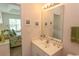 Bathroom with vanity, mirror, and view of bedroom at 601 N Hillside Dr. # 3634, North Myrtle Beach, SC 29582
