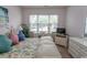 Bedroom with floral bedding, window, and white furniture at 601 N Hillside Dr. # 3634, North Myrtle Beach, SC 29582
