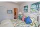 Bedroom with floral bedding, window, and white furniture at 601 N Hillside Dr. # 3634, North Myrtle Beach, SC 29582