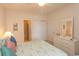 Primary bedroom with a queen bed, dresser, and direct access to the bathroom at 601 N Hillside Dr. # 3634, North Myrtle Beach, SC 29582