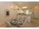 Bright dining area with glass top table and chairs at 601 N Hillside Dr. # 3634, North Myrtle Beach, SC 29582